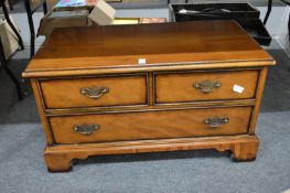 A yew wood TV and video cabinet.