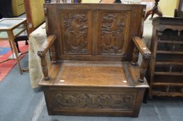 A good carved oak monk's bench.