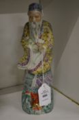A Chinese porcelain figure of a sage.