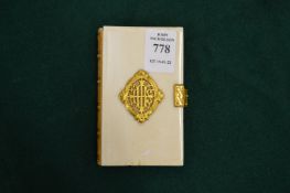 An ivory and gilt metal mounted prayer book.