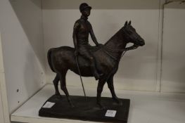 A cast bronze model of a polo player mounted on horseback, the base signed Rosa.