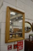 A pine framed mirror.