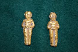 Two gold or gilt metal figural pendants (untested).