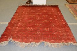 A large Bokhara style carpet.