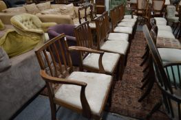 A set of eight 19th century mahogany dining chairs, two with arms, all with vertical tie bars,