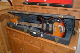 A cased electric guitar.