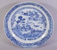 A CHINESE BLUE AND WHITE PORCELAIN DISH, the centre painted with a landscape setting, the foreground