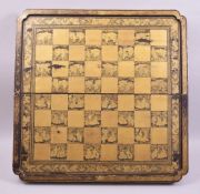 A SUPERB CHINESE GILDED AND LACQUERED FOLDING CHESS BOARD, of finest quality, 56cm wide.