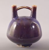 AN UNUSUAL CHINESE TWO HEADED FLAMBE FLOWER POT, with mark to base, 20cm high.