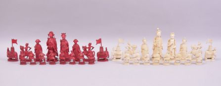 A VERY GOOD 19TH CENTURY CARVED AND STAINED IVORY PART CHESS SET, the kings and queens not matching,