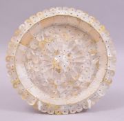 AN INDIAN GOA MOTHER OF PEARL CIRCULAR DISH, the dish entirely constructed of shaped mother of pearl