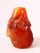 A CHINESE CARVED AGATE SNUFF BOTTLE, 5.5cm.