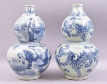 A PAIR OF CHINESE BLUE AND WHITE DOUBLE GOURD PORCELAIN VASES, one decorated with figures in a