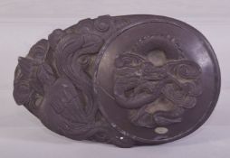 A GOOOD CHINESE CARVED INKSTONE, decorated with dragon and phoenix, 16cm long.
