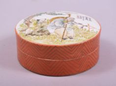 A CHINESE FAMILLE VERTE CIRCULAR PORCELAIN BOX AND COVER, the cover painted with two figures in an