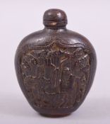 A CHINESE CARVED SNUFF BOTTLE AND STOPPER, with a panel to each side depicting deer, bats and a