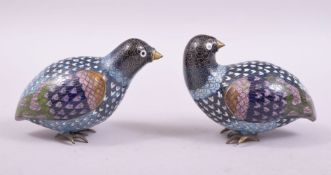 A GOOD PAIR OF CHINESE CLOISONNE MODELS OF QUAIL on wooden stands, both approx. 9cm long.