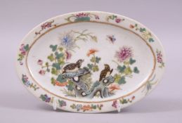 A CHINESE FAMILLE VERTE OVAL SHAPED PORCELAIN DISH, painted with birds and flora, six character mark
