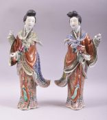 A PAIR OF JAPANESE PORCELAIN FIGURES of geishas, each wearing well modelled and painted robes,