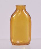 A CHINESE AMBER COLOURED GLASS SNUFF BOTTLE, 6.5cm.