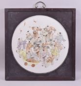 A LARGE CHINESE FRAMED PORCELAIN PANEL, painted with many children and bats, inset within a wooden