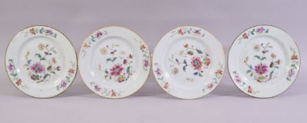 FOUR SMALL CHINESE FAMILLE ROSE PORCELAIN PLATES, each painted with a floral spray central, 16.5cm