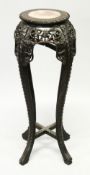 A CHINESE HARDWOOD AND MARBLE INSET CIRCULAR VASE STAND, with pierced and carved frieze and