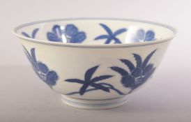 A CHINESE MING STYLE BLUE AND WHITE PORCELAIN BOWL, decorated with flowers, six character mark to