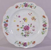 A CHINESE FAMILLE ROSE PORCELAIN PLATE, painted with colourful flowers, 23cm diameter.