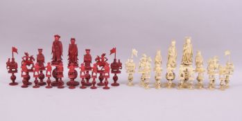 A GOOD 19TH CENTURY CHINESE CARVED AND STAINED RED AND WHITE IVORY CHESS SET, each piece on a carved