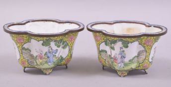 A PAIR OF CHINESE CANTON ENAMELLED QUATREFOIL MINIATURE JARDINIERES, decorated with panels depicting