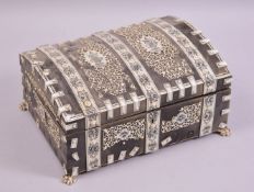 AN INDIAN EBONY BONE, PENWORK DECORATED DOMED TOP LIDDED CASKET, with fitted interior (af), 28cm