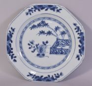 A CHINESE BLUE AND WHITE PORCELAIN DISH, painted with native flora, 21.5cm diameter.