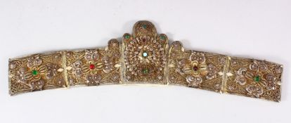 AN ISLAMIC FILIGREE BELT SECTION, with fine filigree work and inset with semi precious stones,