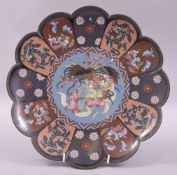 A JAPANESE PETAL FORM CLOISSONE DISH, decorated with multiple panels containing cockerels, chilong