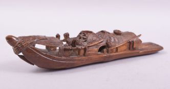 A CHINESE BAMBOO CARVING OF A BOAT, 22.5cm long.