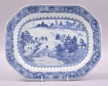 A GOOD CHINESE BLUE AND WHITE PORCELAIN DISH, painted with a landscape with a lake, buildings and