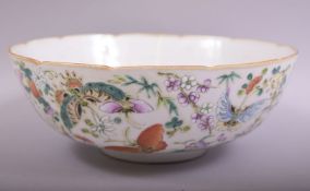 A LARGE CHINESE FAMILLE VERTE PORCELAIN BUTTERFLY DISH, the exterior profusely painted with