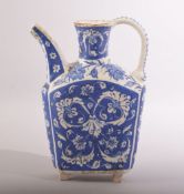 A SMALL TURKISK BLUE AND WHITE KUTAHYA WATER JUG, with sprays of decorative floral motifs, 20.5cm