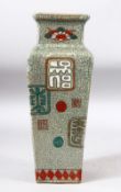 A CHINESE SQUARE FORM CRACKLE GLAZE VASE, painted with a script / icons, 31cm high.
