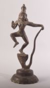 AN INDIAN BRONZE FIGURE OF A DEITY, stood upon a multi headed snake, possibly Vishnu stood upon