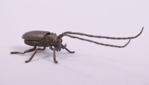 A JAPANESE BRONZE MODEL OF A BEETLE.