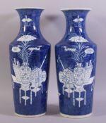 A LARGE PAIR OF CHINESE BLUE AND WHITE PORCELAIN VASES, painted with objects such as a vase on