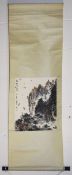 A CHINESE SCROLL PAINTING of a mountainous landscape with boats, with script top left and red