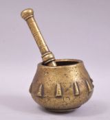 A SMALL 17TH CENTURY BRASS PESTLE AND MORTAR.