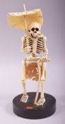 A SUPERB JAPANESE CARVED IVORY OKIMONO OF A SKELETON, fitted to a circular wooden stand, the