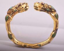 A CHINESE GILDED BRONZE BRACELET, 8cm wide.