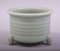 A CHINESE CELADON LONGQUAN TRIPOD CENSER, 7.5cm high, 11cm high.