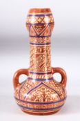 A HISPANO MOREQUE LUSTRE GLAZE TWIN HANDLE VASE, decorated with a copper and blue lustre depicting