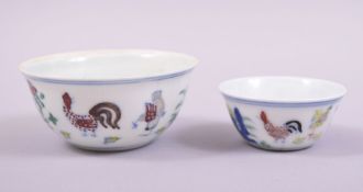 TWO DOUCAI PORCELAIN CHICKEN CUPS, both with six character mark to base, 8.5cm and 6cm (2).